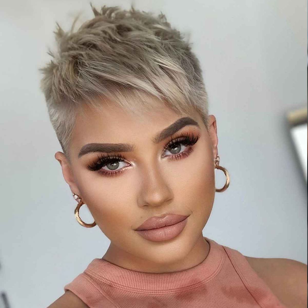 Choppy Textured Pixie Cut with Fade Undercut and Edgy Fringe: 11 Bold Modern Styles